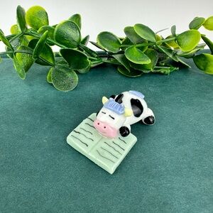 Vintage Mini Black And White Cow Figurine Sleeping on Book